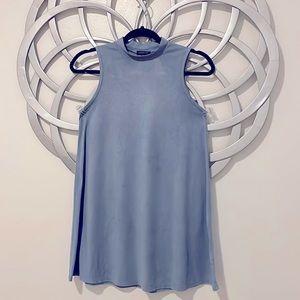 Sleeveless mock neck tunic.